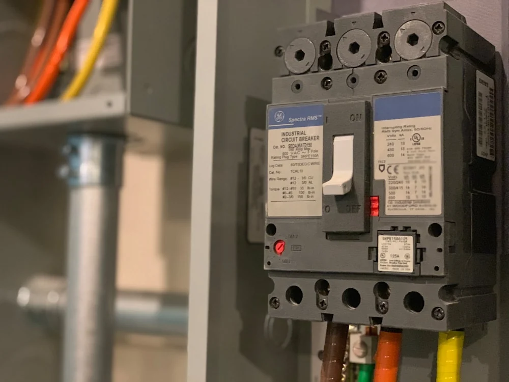 RVIA-certified tech diagnosing an RV converter and 12V electrical panel on-site