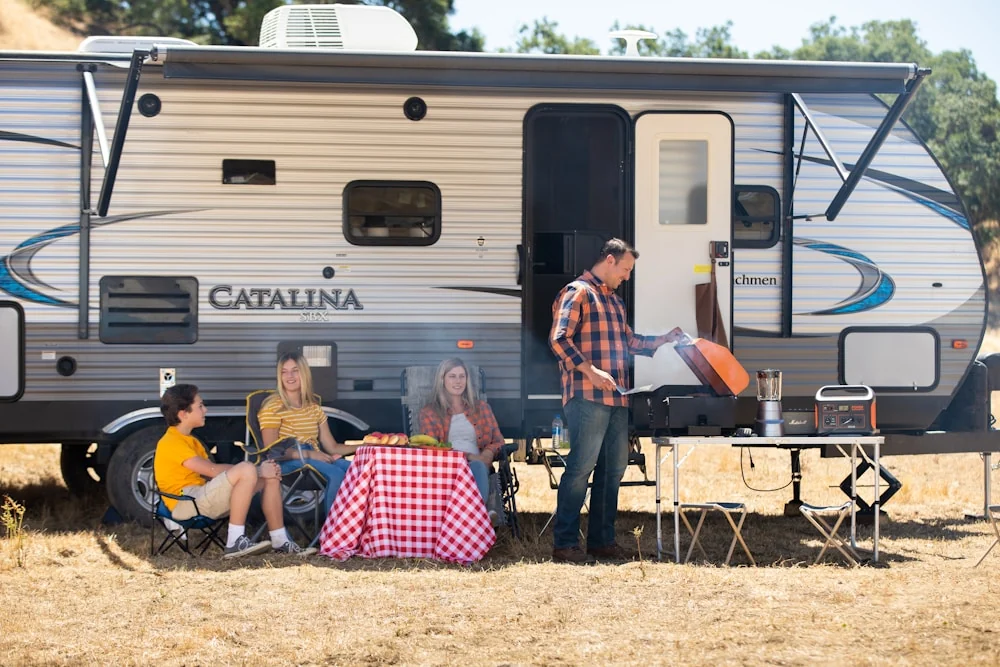 Mobile RV technician servicing an Onan generator at a Florida campground or driveway